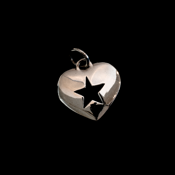 silver rockstar heart pendant on black.