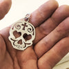 Lola Bell Skull Pendant back side in hand 
