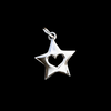 heart inside a star pendant on black. 