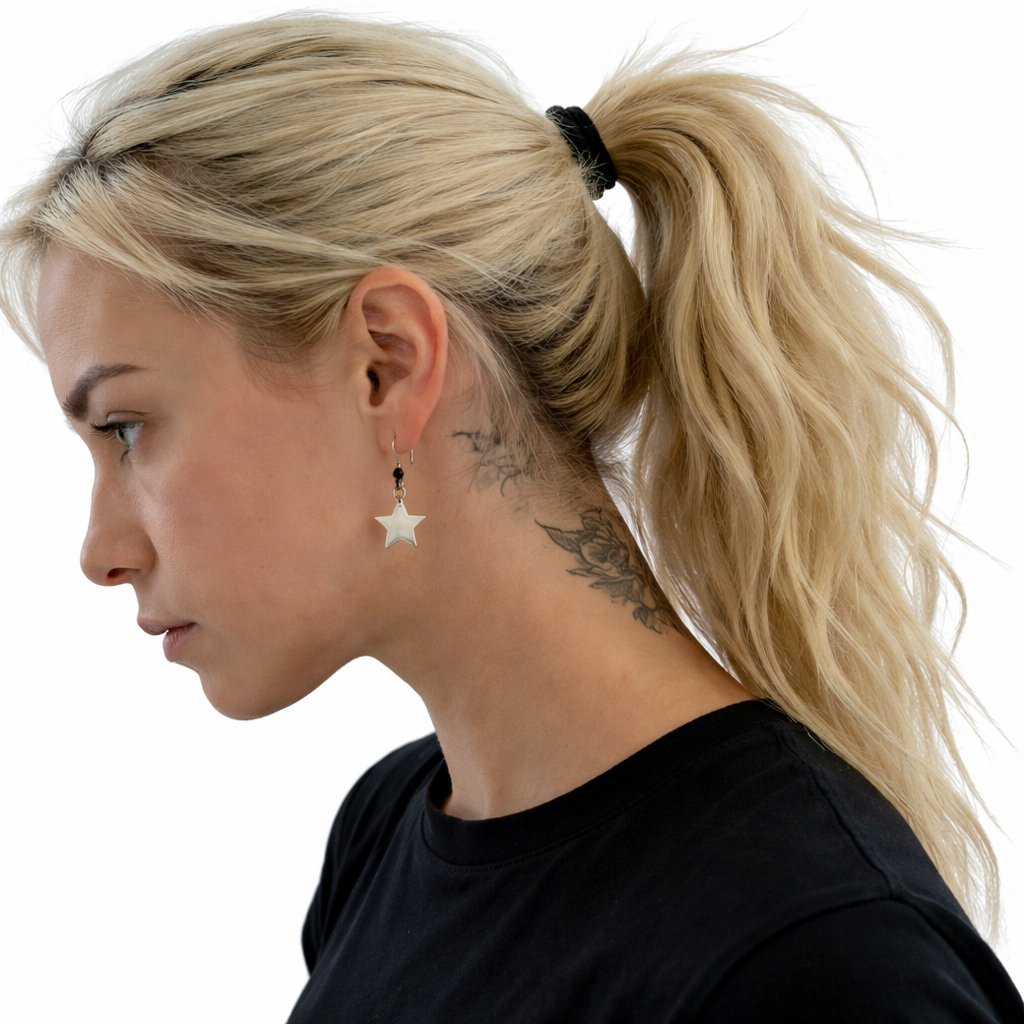 Woman wearing a star-shaped earring on a white background