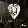 Guitar Pic Skull pendant in a fender guitar
