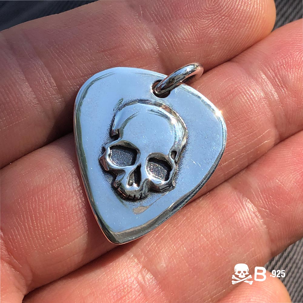 Guitar Pic Skull held in the hand.