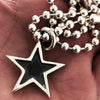 The Star Pendant with chain in hand 